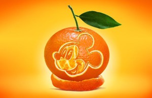 Creative synthesis, making a Mickey Mouse pattern growing on an orange – photo synthesis